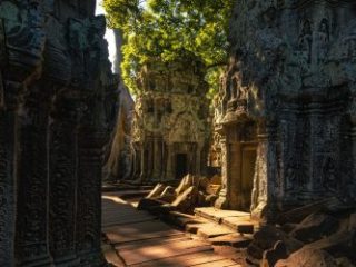 Ancient stone ruins in Angkor, Cambodia - Journey House Travel, OK