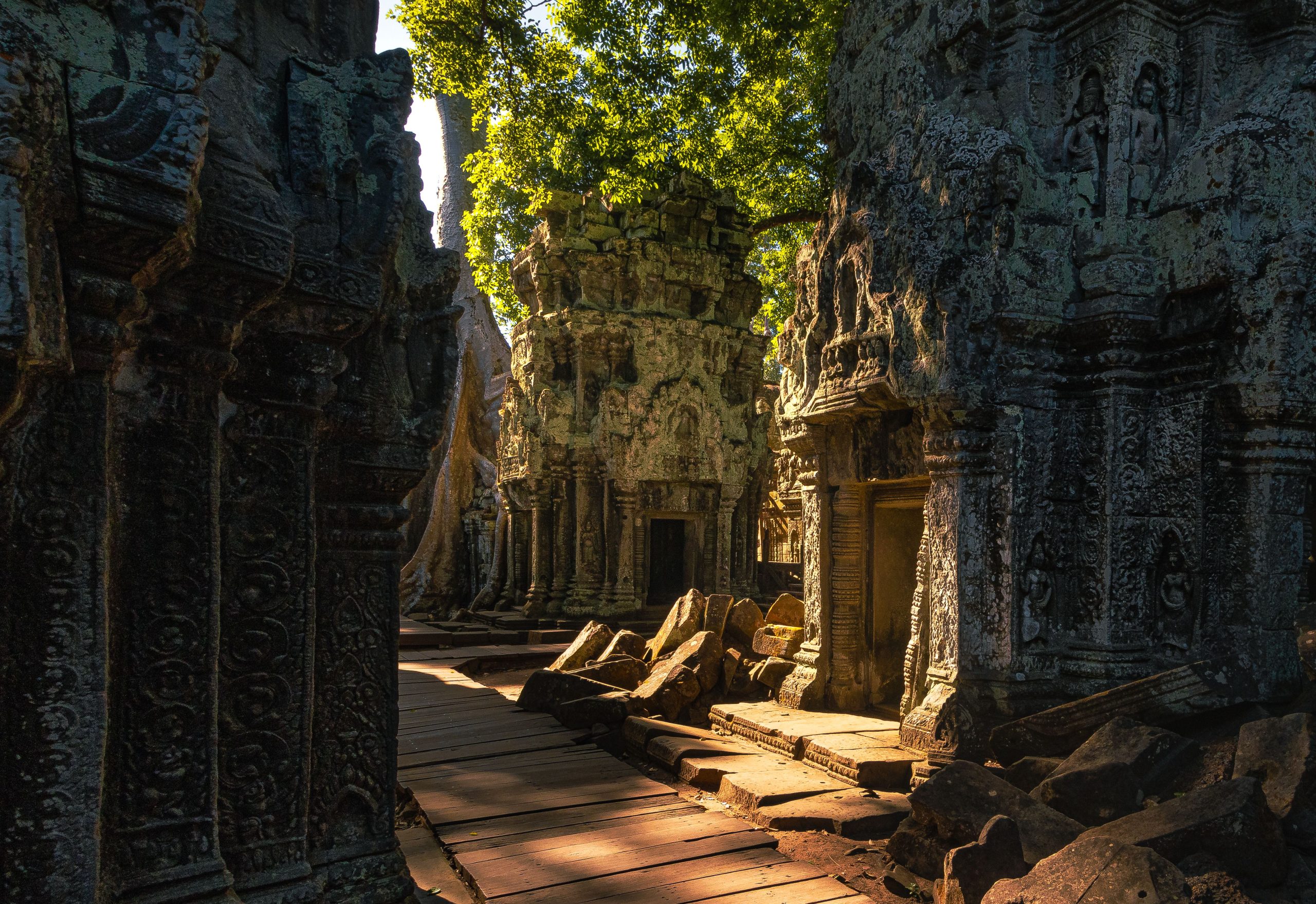Ancient stone ruins in Angkor, Cambodia - Journey House Travel, OK
