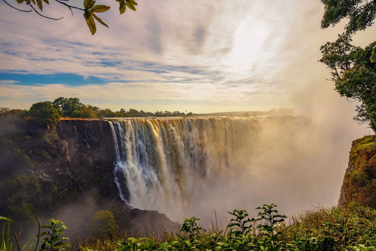Sunset at the Victoria Falls on Zambezi River in Zimbabwe - Journey House Travel