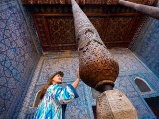 Woman tourist at old city Khiva in Uzbekistan - Journey House Travel