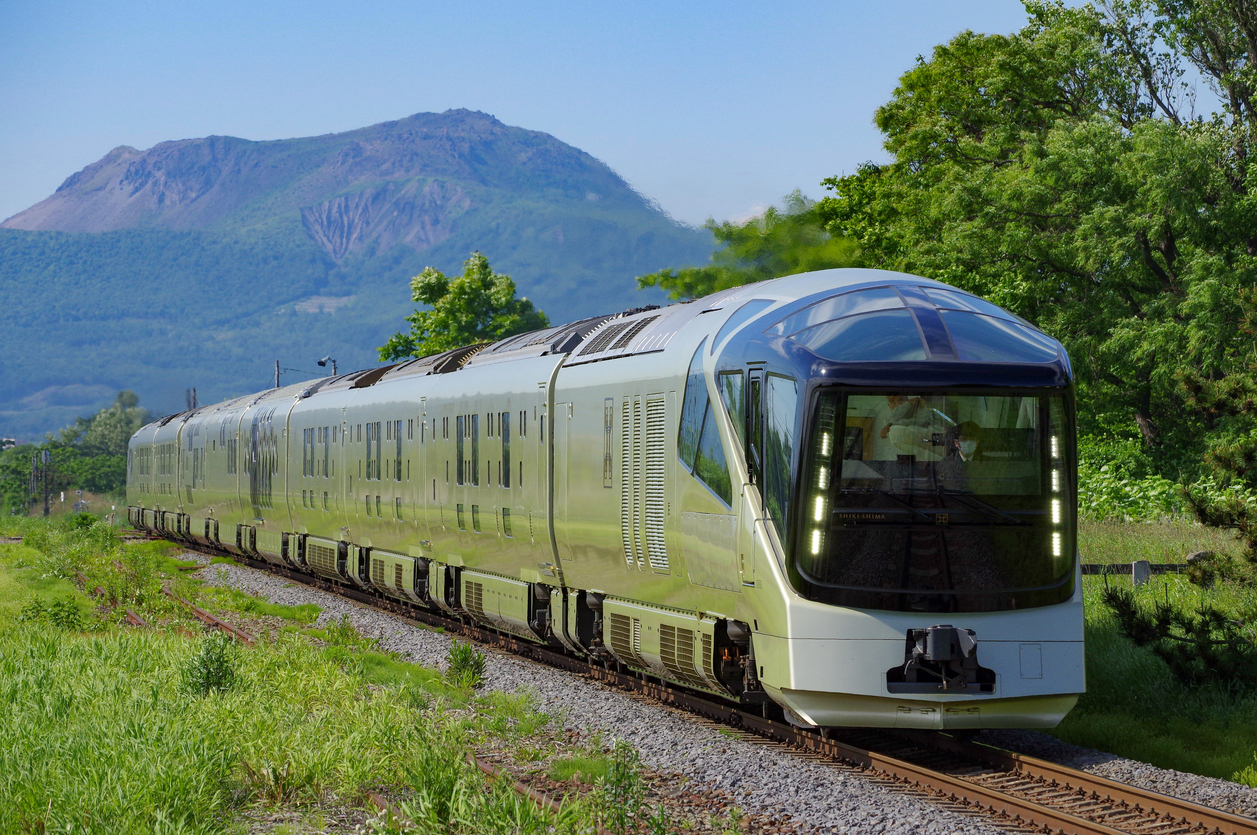 Clear blue sky, Mt. Usu and Luxury train - Journey House Travel